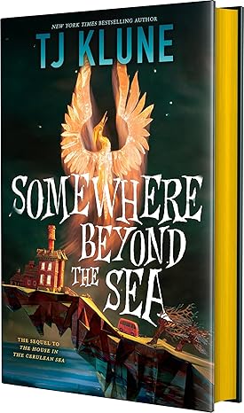 Book cover of Somewhere Beyond the Sea by TJ Klune that shows an artistic drawing of a house on a cliffside with a golden phoenix.