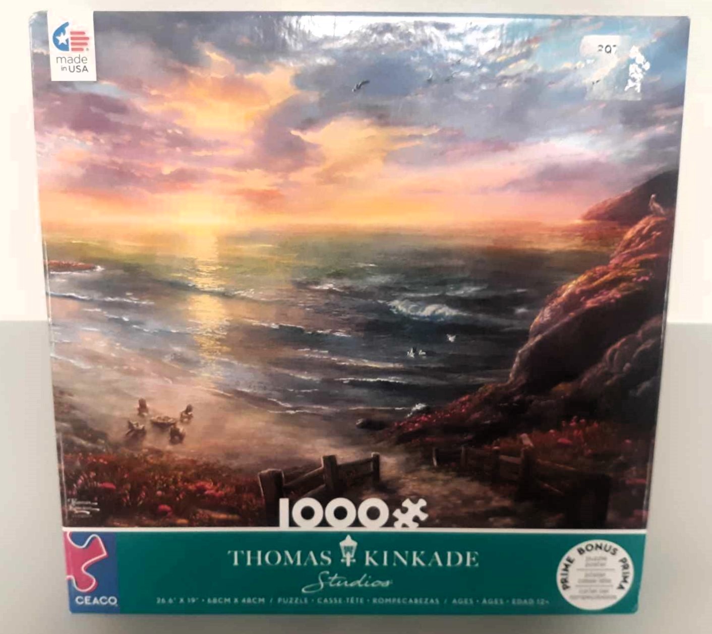 Image of puzzle cover titled "Beachside Gathering" with an artistic rendering of an ocean next to some cliffs and a sandy beach.