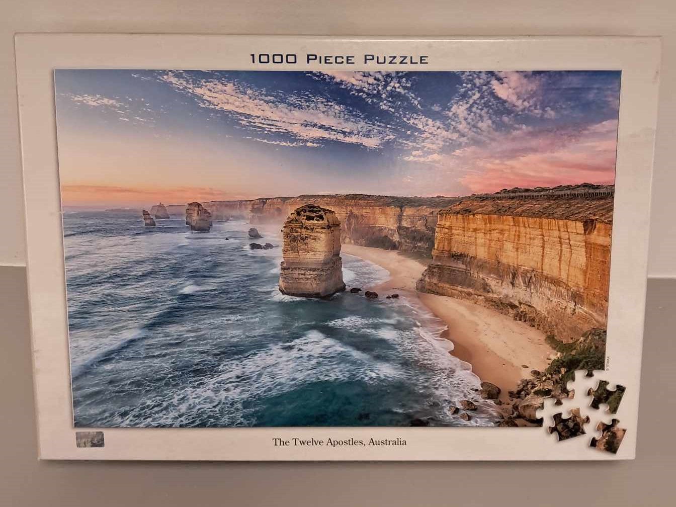 Image of a puzzle cover with the picture of the twelve apostles shoreline in Australia.