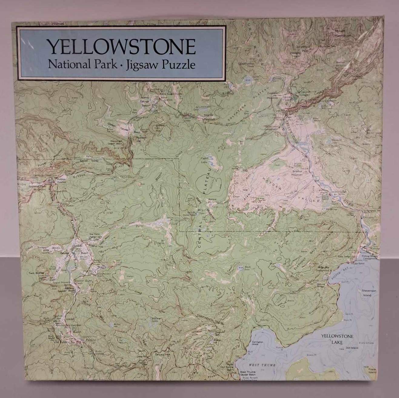 Image of a puzzle cover showing a topographical map of Yellowstone National Park.