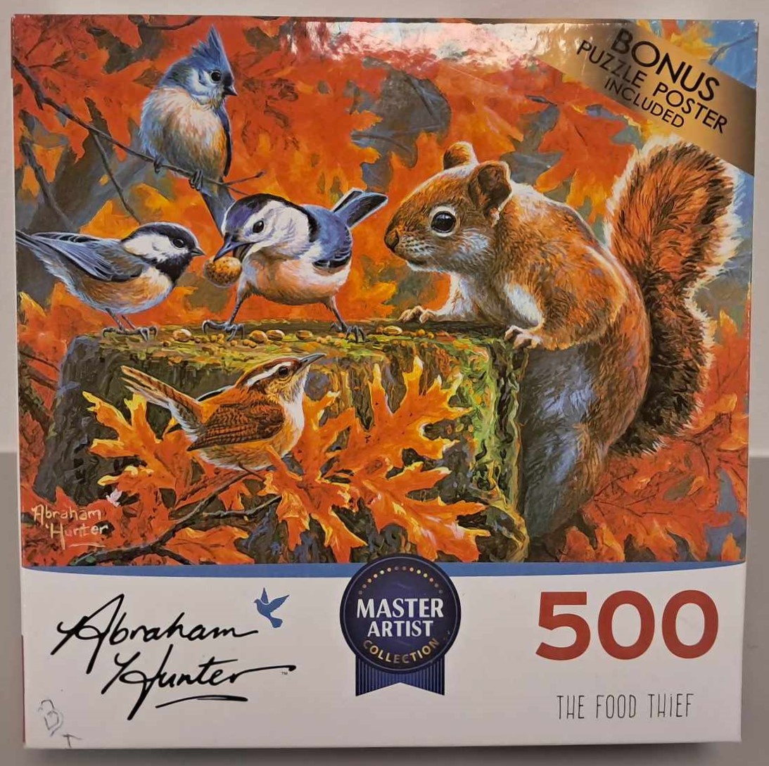 Image of a puzzle cover with a squirrel on a tree stump and three blue jay birds are stealing the squirrels food.