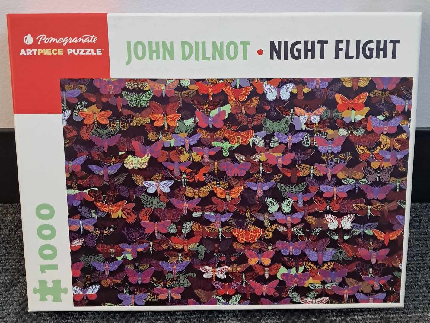 Image of a puzzle cover with drawings of many different types of butterflies of different covers.