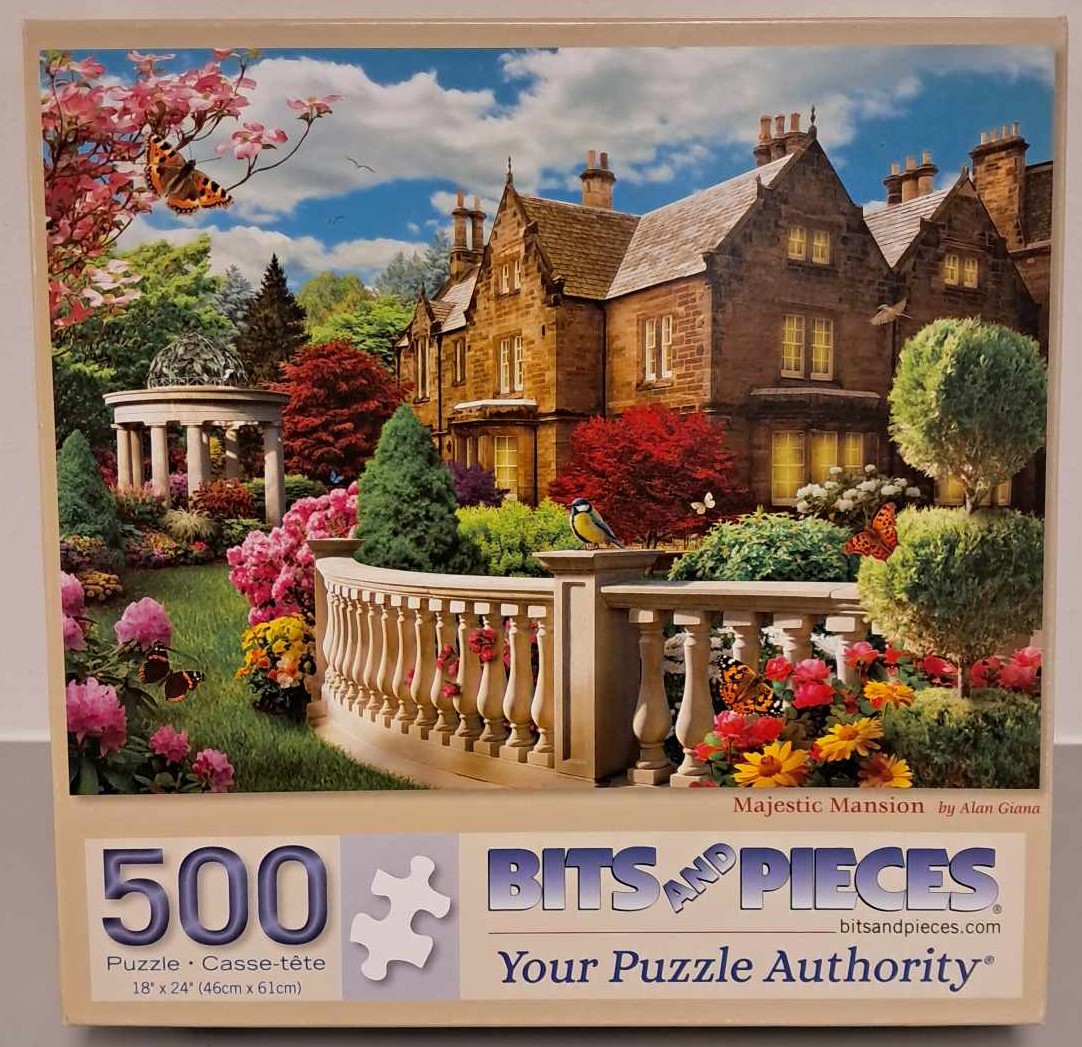 Puzzle cover showing an image of a large mansion with a gazebo and lush garden.