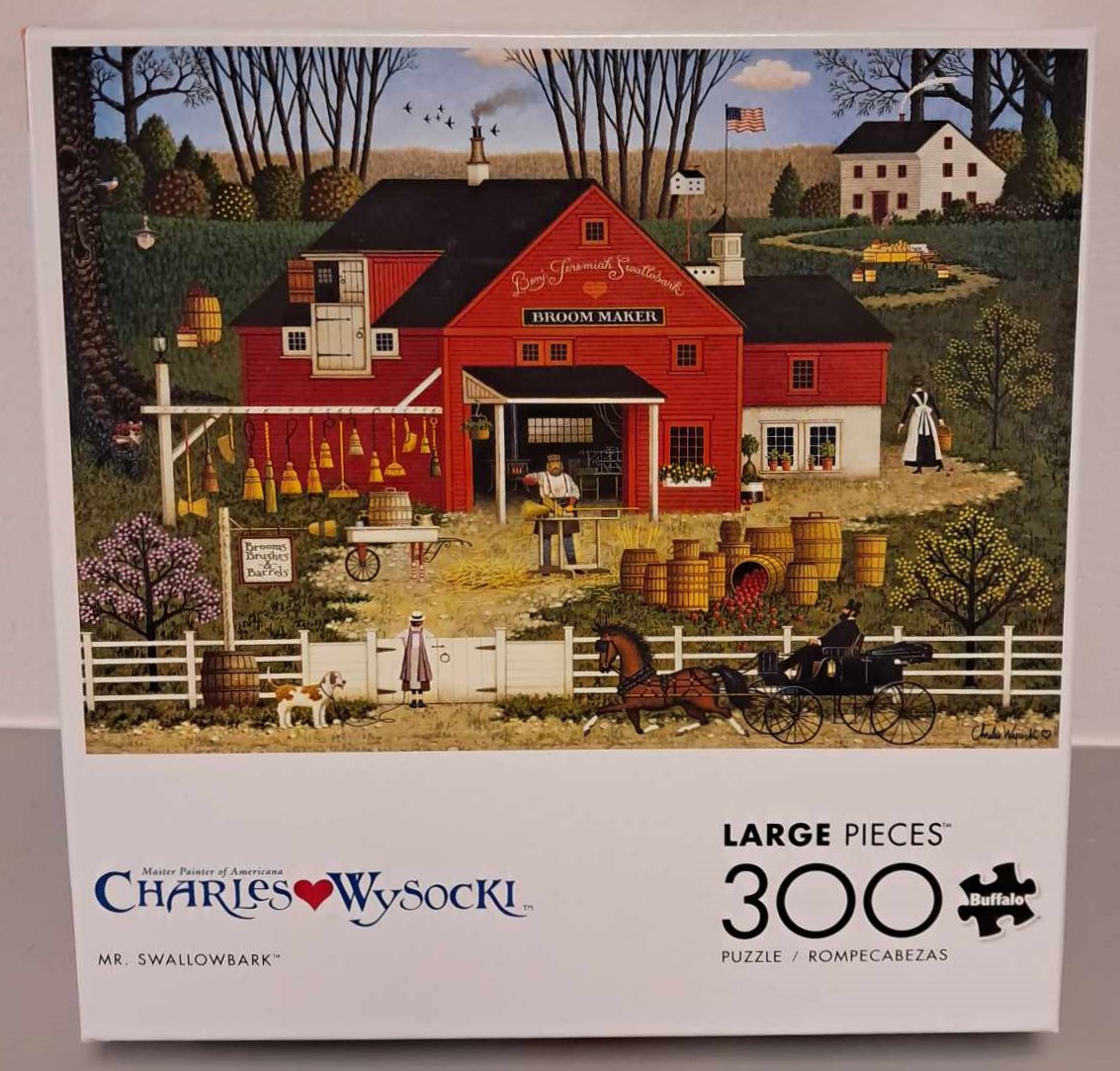 Puzzle Cover with an image of a red barn and a man standing at a work table making broom sticks.