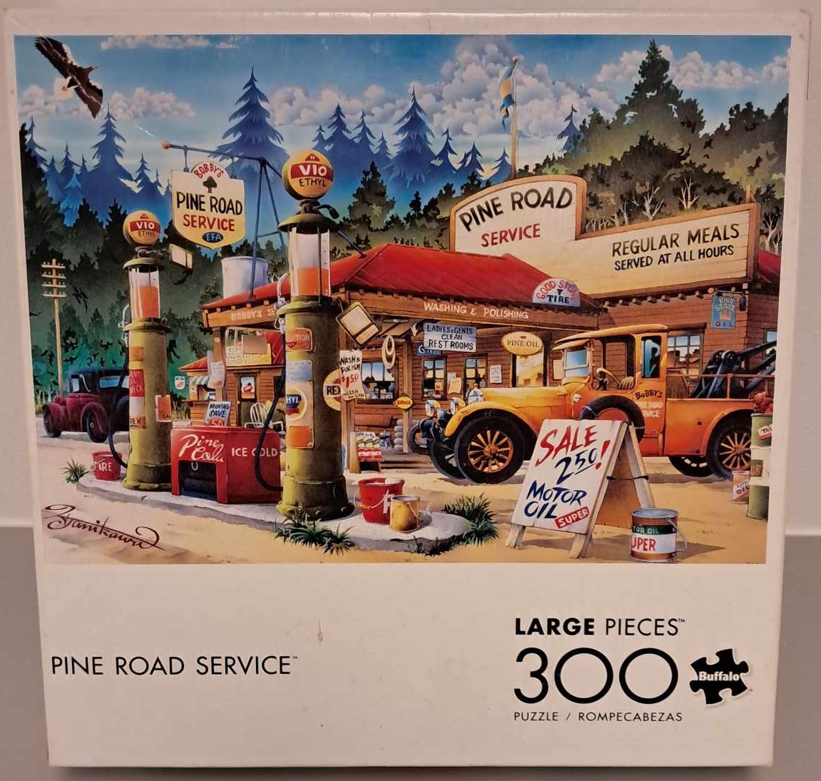 Puzzle cover of an artistic drawing of an old style gas station with older models of cars.