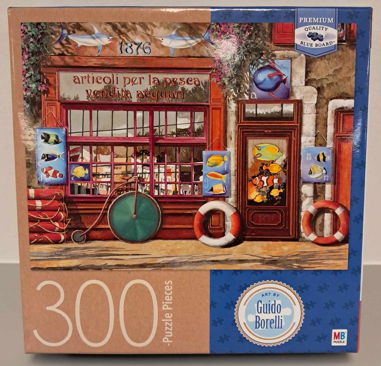 Puzzle cover showing art by Guido Borellie, it's an image of a store front with fishermen decore.