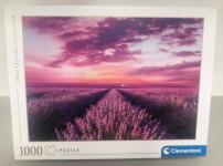 Image of a puzzle cover titled "Lavender Field" that shows a purple sky over a field of lavender plants.
