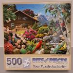 Puzzle cover of an image of a garden with many different types of plants and birds and butterflies.